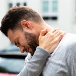 Man Suffering From Neck Pain